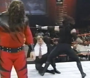 Backfired: Paul Bearer orders Kane to destroy the Undertaker, but instead, The Undertaker destroys Paul Bearer. photo: wwe.com
