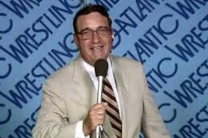 Mid-Atlantic Championship Wrestling announcer Bob Caudle holding microphone.